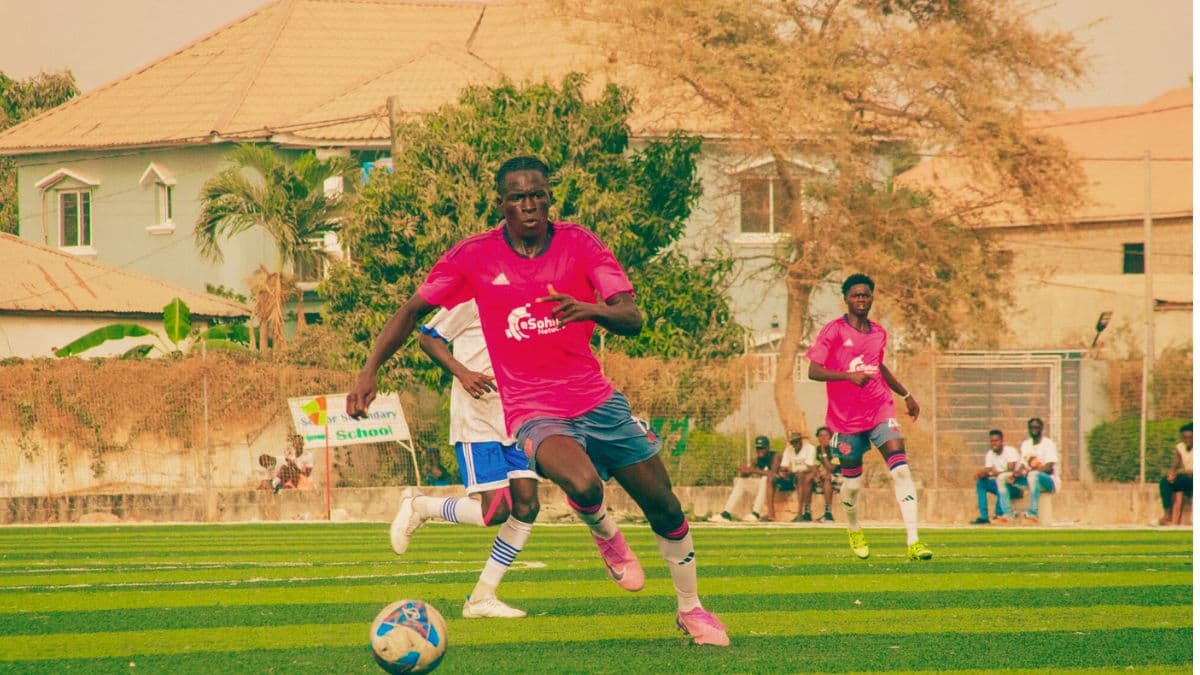 eSohna Academy player carrying the ball during a football match