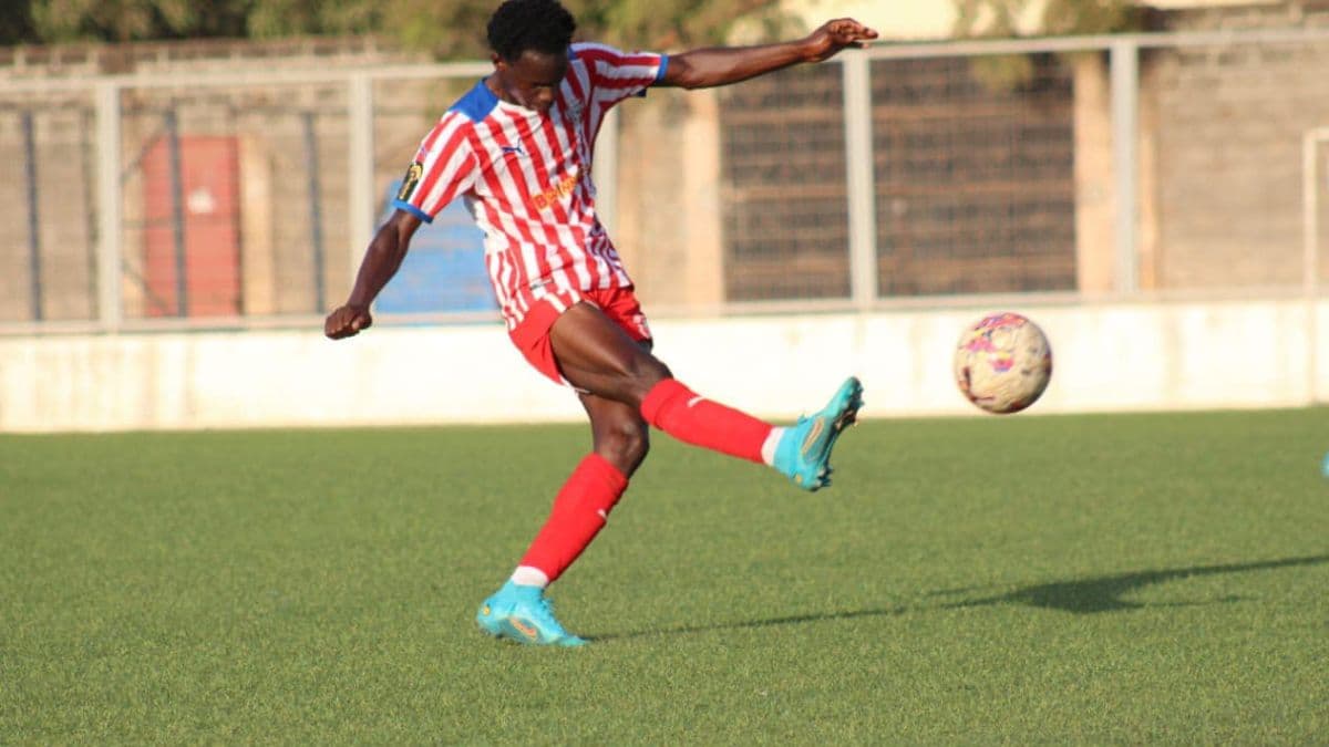 eSohna Academy player striking a football on the pitch
